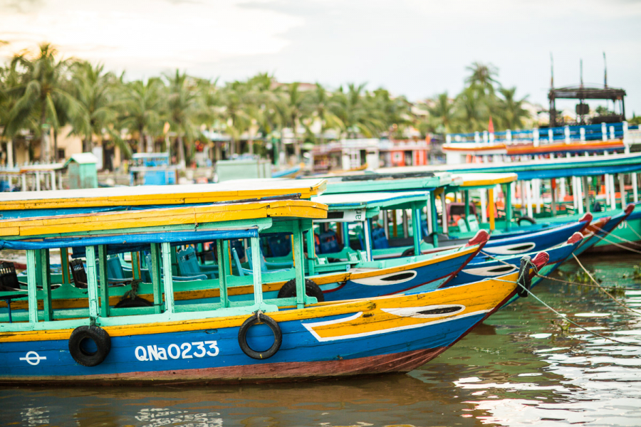 Colourful boats line the old ferry quay, ready to take passengers on short cruises