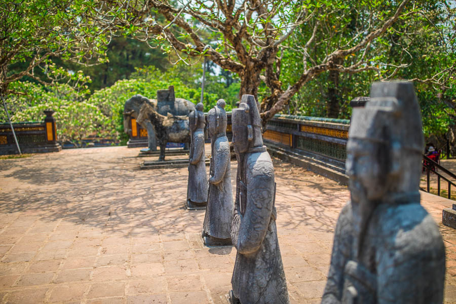 Statues of mandarins and generals stand guard outside the tomb of Emperor Tự Đức.